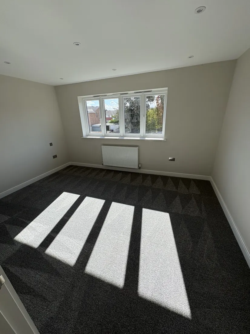 Clean carpeted bedroom